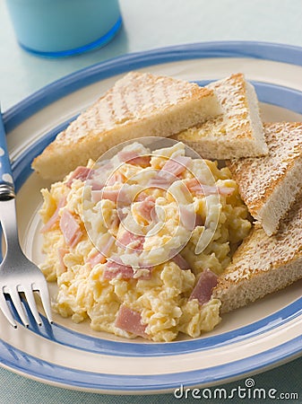 Cheesy Scrambled Egg with Ham and Toasted Triangle Stock Photo