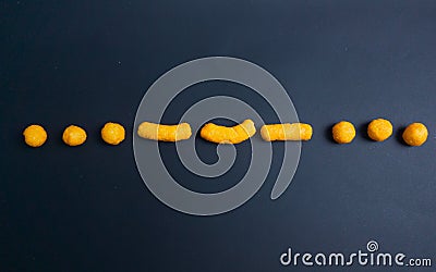 cheetos snack making morse code of SOS sign in black paper Stock Photo