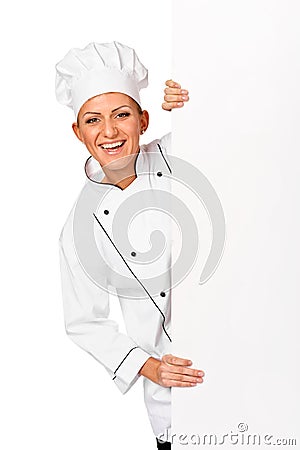 Chef, baker or cook smiling happy holding blank white paper sign Stock Photo