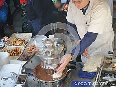 Chef at Chocolate fountain Editorial Stock Photo