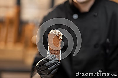 Chef with chocolate ice cream, close-up Stock Photo