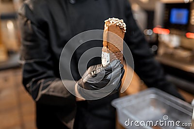 Chef with chocolate ice cream, close-up Stock Photo