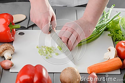 Chef chopping spring onions Stock Photo