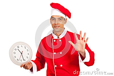 Chef with clock gesticulate five minutes Stock Photo