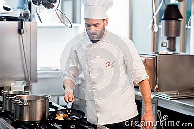 Chef cook at the kitchen Stock Photo