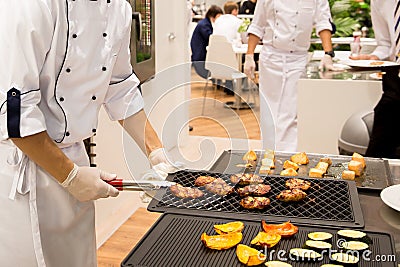 Chef cooked meat steaks on the grill Stock Photo