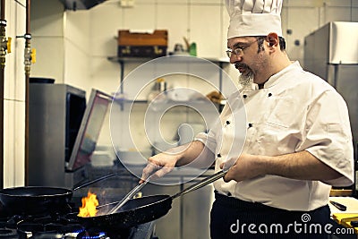 Chef cooking food Stock Photo