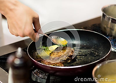Chef cooking food in the kitchen, Chef preparing food Stock Photo
