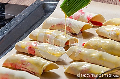 The chef cuts the dough with a knife Stock Photo