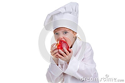 Chef girl in a cap cook uniform, biting the red apple. Human emotions, facial expression feeling, attitude. Landscape Stock Photo