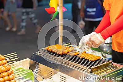 Chef grilled meat ball and sausage on smokeless grill Stock Photo