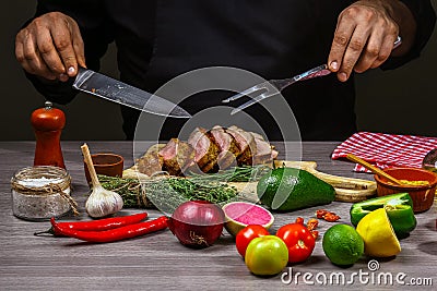 Chef hands Cooking meat steak, vegetables and spices with by chef hands on wooden background. Food recipe concept Stock Photo