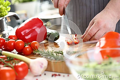 Chef Hands Cutting Red Hot Chili Pepper Halves Stock Photo