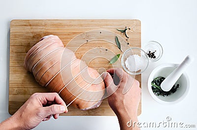 Chef hands with raw meat pork roast cooking preparation Stock Photo