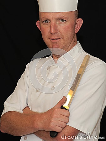 Chef holding knife Stock Photo