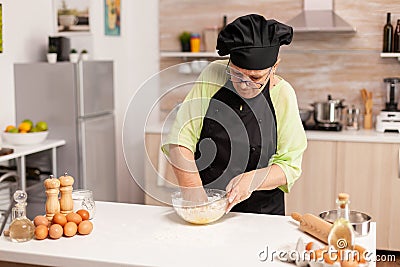 Chef in kitchen cooking Stock Photo
