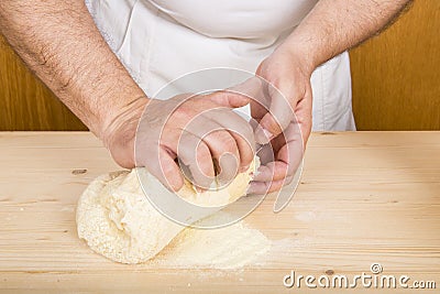 Chef kneading dough to make gnocchi Stock Photo
