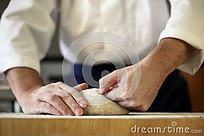 Chef kneading yeast dough Stock Photo