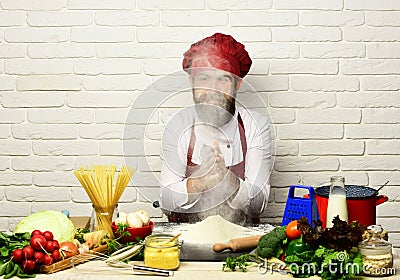 Chef makes dough. Cook with face hidden in flour cloud Stock Photo