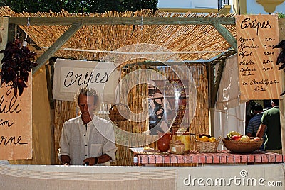 Chef making crepes on market stall, Spain. Editorial Stock Photo