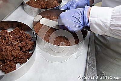 Chef Making Crust Cake From Chocolate and Cream Stock Photo