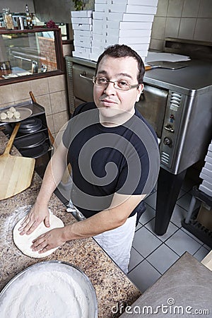 Chef making a pizza Stock Photo