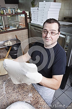 Chef making a pizza Stock Photo