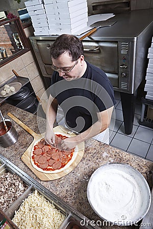 Chef making a pizza Stock Photo