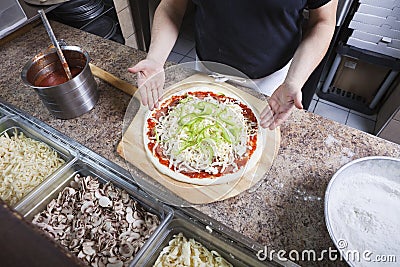 Chef making a pizza Stock Photo