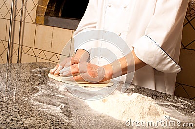 Chef making a Pizza Base Stock Photo