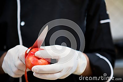 Chef peeling tomatoes Stock Photo