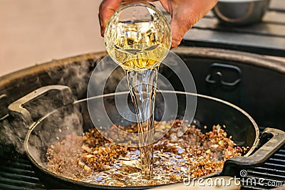 Chef prepares ingredients for bulgur on the grill Stock Photo