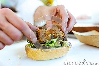 Chef preparing bread with meatballs in a food truck. Stock Photo
