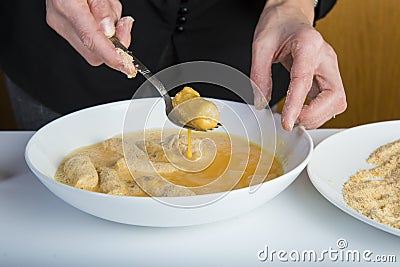 Chef preparing croquettes in the kitchen Stock Photo