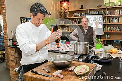 Chef preparing ingredients at cooking class for beer and food pairing Editorial Stock Photo