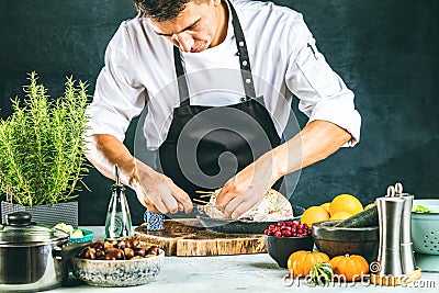 Chef preparing stufet duck in kitchen or market for christmas. Stock Photo