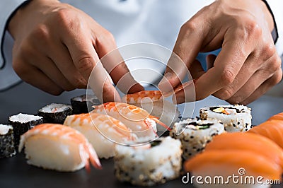 Chef preparing sushi Stock Photo
