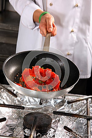 Chef preparing tomato Stock Photo