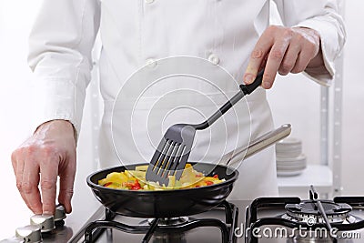 Chef roasting vegetables Stock Photo