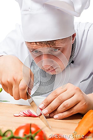 Chef shredding a portrait of radishes salad Stock Photo