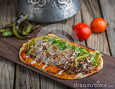 Chef Special Shawarma served in wooden board side view on wooden table background Stock Photo