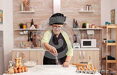 Chef sprinkling baking powder Stock Photo