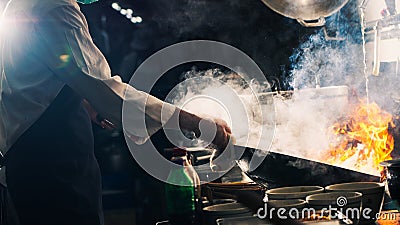 Chef stir fry in wok Stock Photo