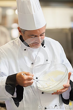 Chef whisking cream Stock Photo