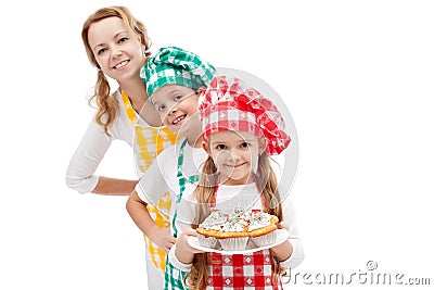 Chefs brigade preparing muffins - woman with kids Stock Photo