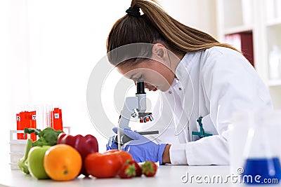 Cheking food quality at professional lab with microscope Stock Photo