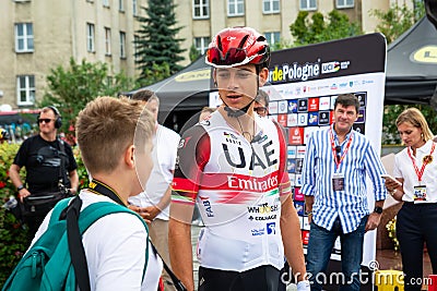 Chelm, Lubelskie, Poland - July 31, 2022: 79 Tour de Pologne, A rider from the UAE Team Emirates group talks to a young fan Editorial Stock Photo