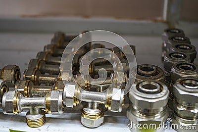 Chelyabinsk Region, Russia - JUNE 2019. Plumbing sales. Rack with goods. Some metal valves and fittings on a shelf in a workshop Editorial Stock Photo