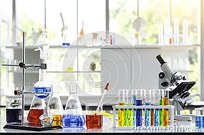 Chemical Liquid test tube and Microscope in Laboratory. Stock Photo