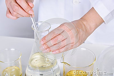 Chemical reagent pouring and mixing, Laboratory and science experiments, Formulating the chemical Stock Photo